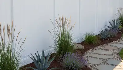 White privacy fence installation by Chop Chop Landscaping in Orange County, CA showcasing expert craftsmanship
